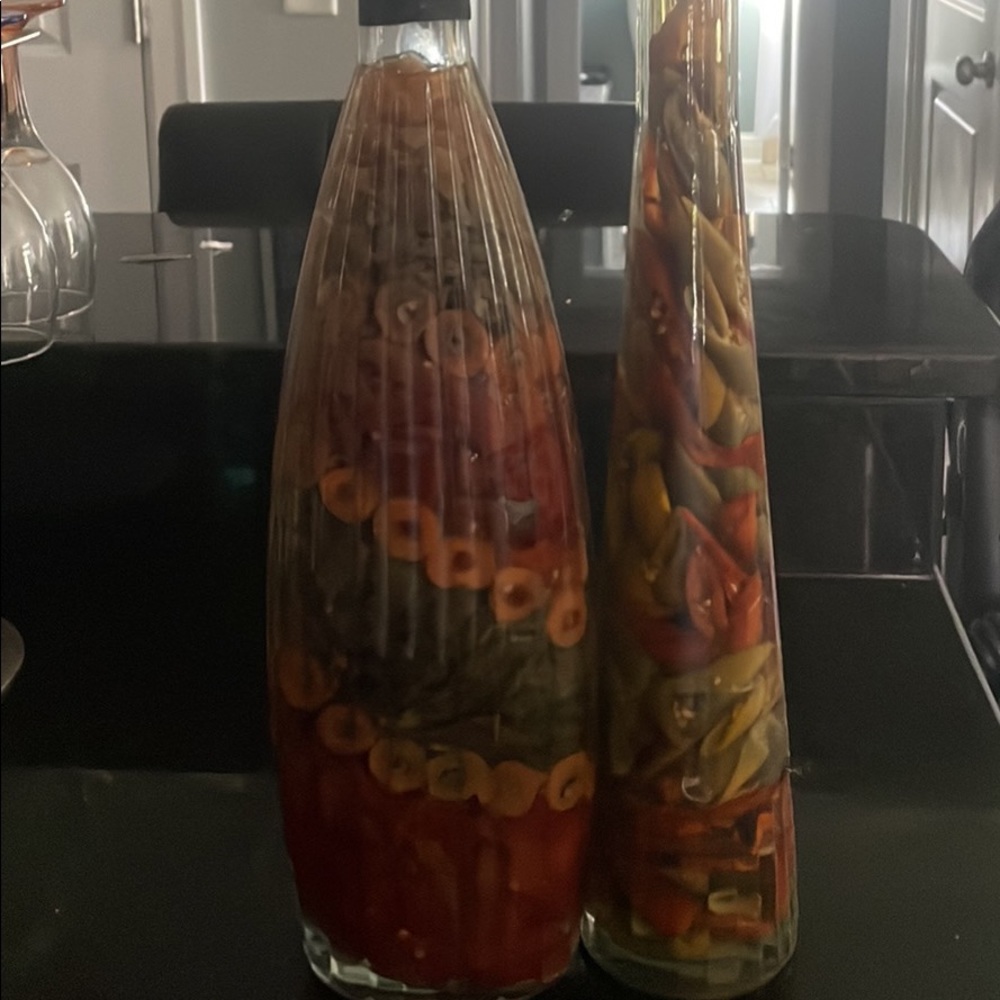 Decorative olive and pepper glass bottles